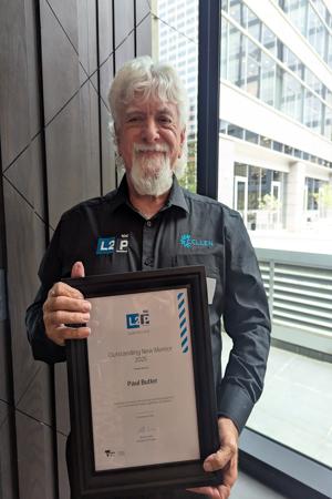 Paul-Butler-with-award-300x450.jpg
